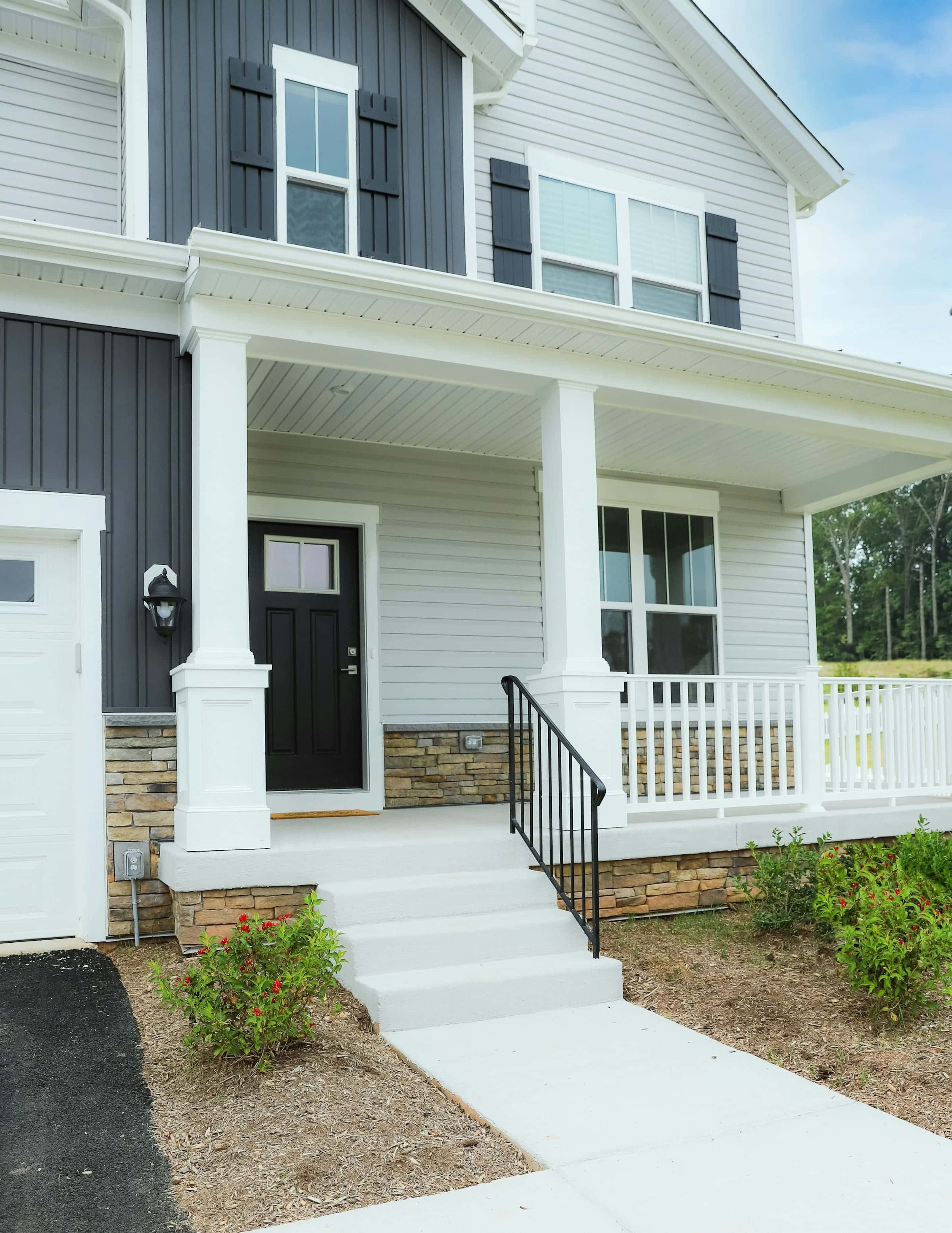 White lap siding and porch columns on a new home